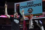Gonzaga's Drew Timme (2) celebrates after cutting a piece of the net after Gonzaga defeated Saint Mary's in an NCAA college basketball championship game at the West Coast Conference tournament Tuesday, March 8, 2022, in Las Vegas. (AP Photo/John Locher)