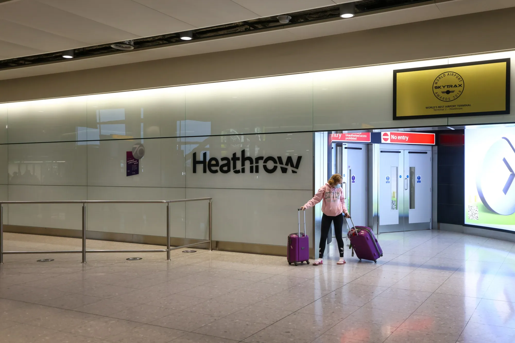 A traveler arrives at London Heathrow Airport.