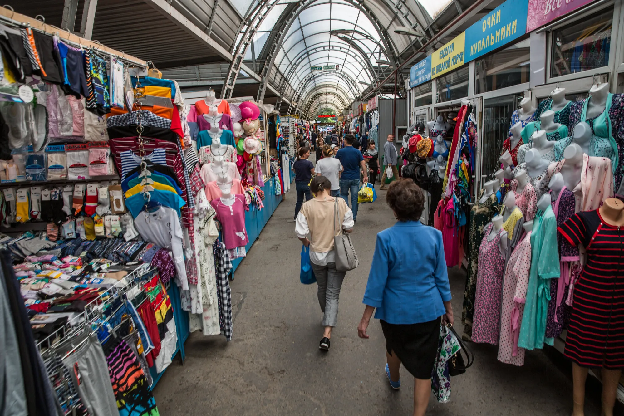 Shoppers walk past stalls near the Green Bazaar in Almaty.