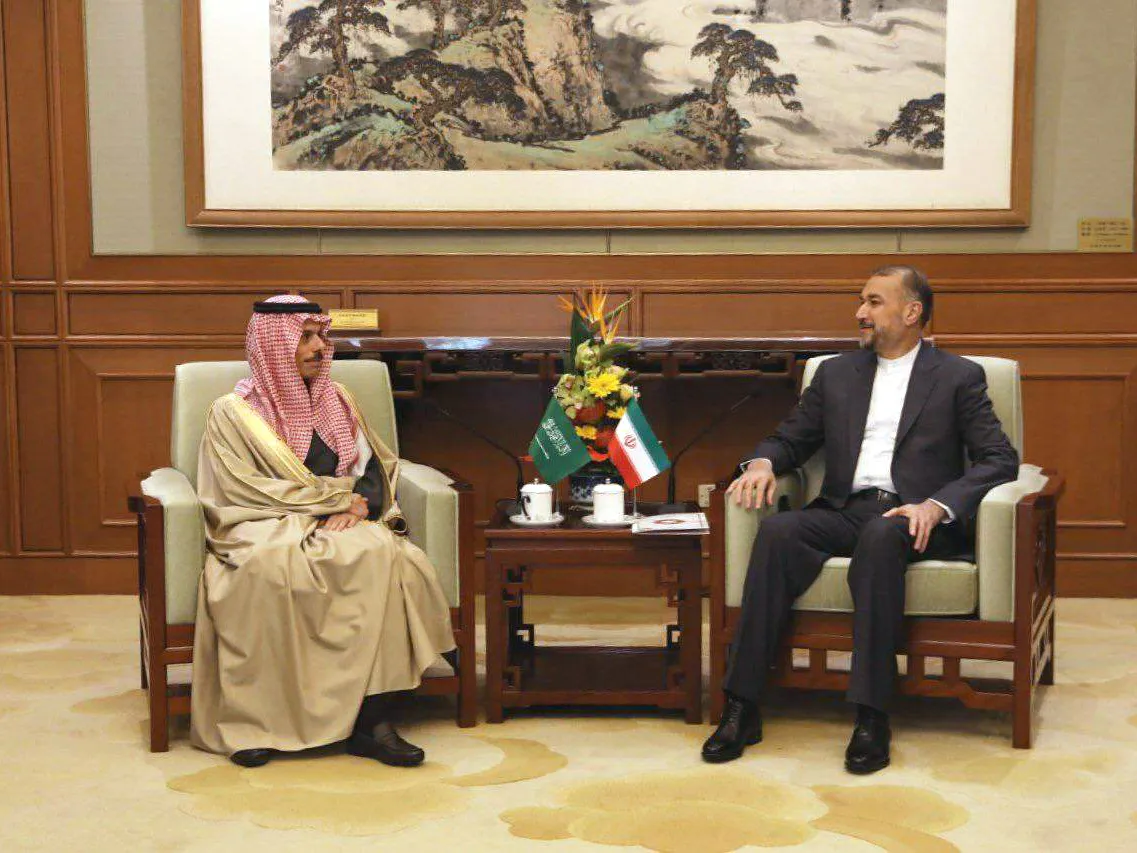 Faisal bin Farhan, left, and his Iranian counterpart Hossein Amirabdollahian meet in Beijing on April 6.