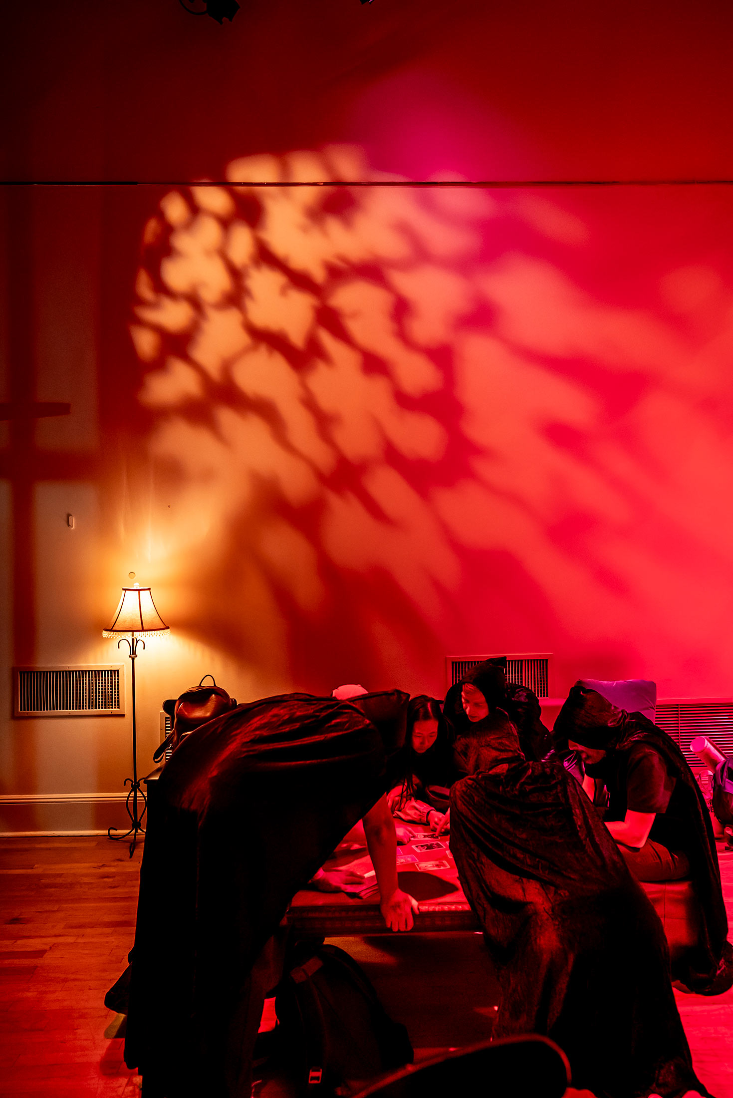 Players conduct a seance to solve the final puzzle at Cell Theatre.