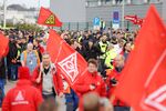 Waving IG Metall union flags, Airbus employees rally in front of a company factory in Hamburg on Nov. 1.