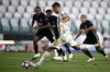 Cristiano Ronaldo of Juventus scores a goal from a penalty kick during the UEFA Champions League match between Juventus FC and Olympique Lyonnais, on Aug. 7. 