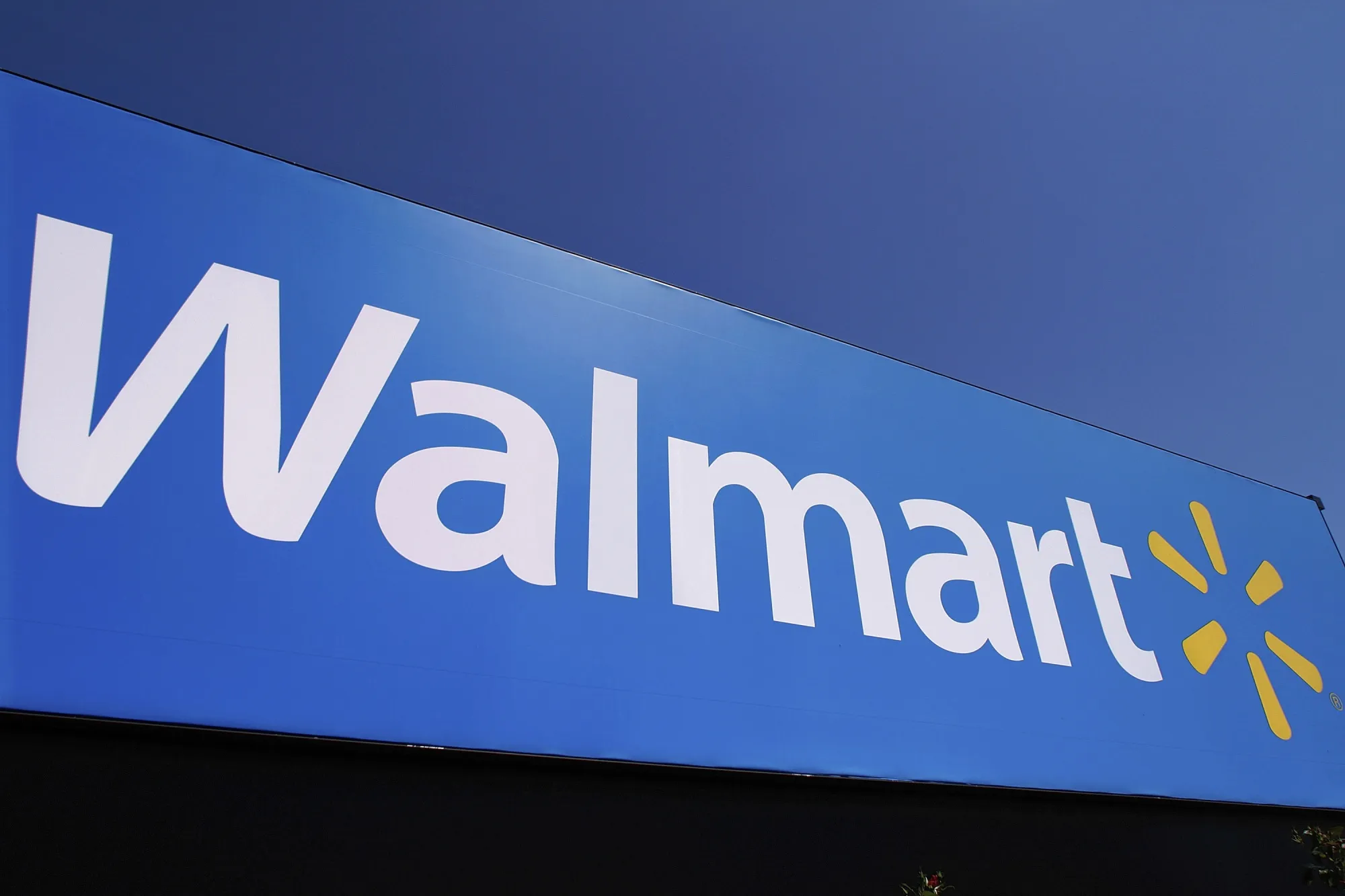 The Walmart logo is displayed on a store in Springfield, Ill., May 16, 2011. Walmart Inc. said Monday, Aug. 15, 2022, that it has signed a deal with Paramount Global to offer the entertainment company's streaming service as a perk to subscribers of the discounter's shipping subscription service. (AP Photo/Seth Perlman, File)