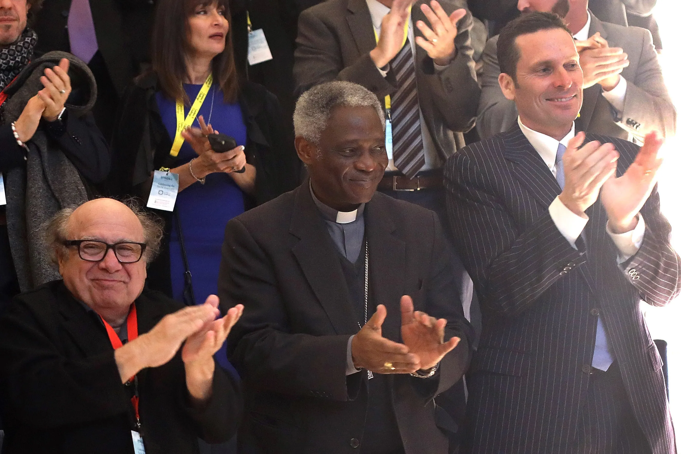 Danny Devito, left, Peter Turkson, center, and Eric Harr at the Laudato Si Challenge Demo Day at the Aula Magna in Rome, Italy, on Dec. 4, 2017. 