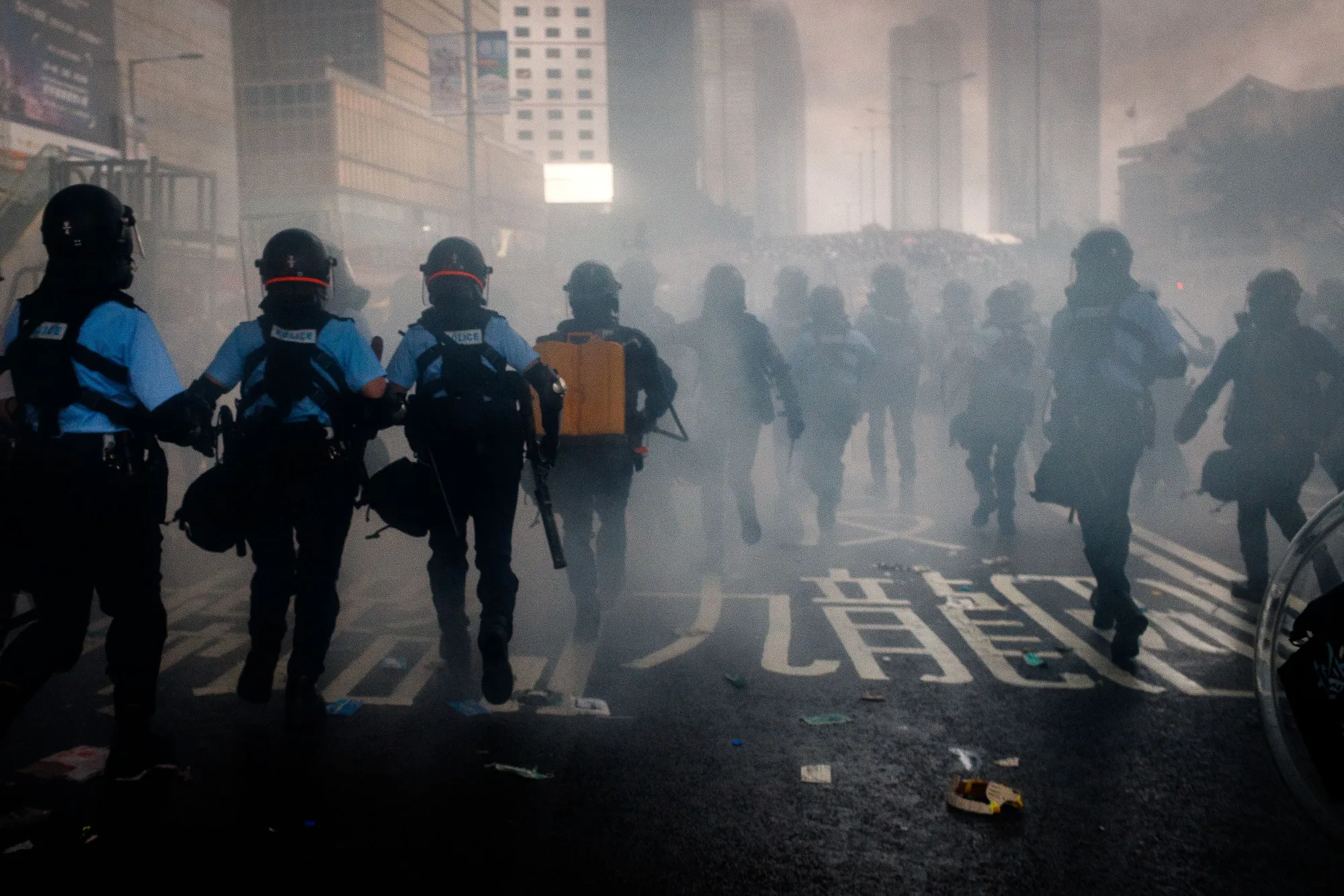 Riot police advance through a cloud of tear gas during a protest in Hong Kong on&nbsp;June 12.