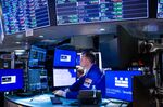 Traders work on the floor of the New York Stock Exchange (NYSE) in New York, U.S., on Monday, Nov. 8, 2021.