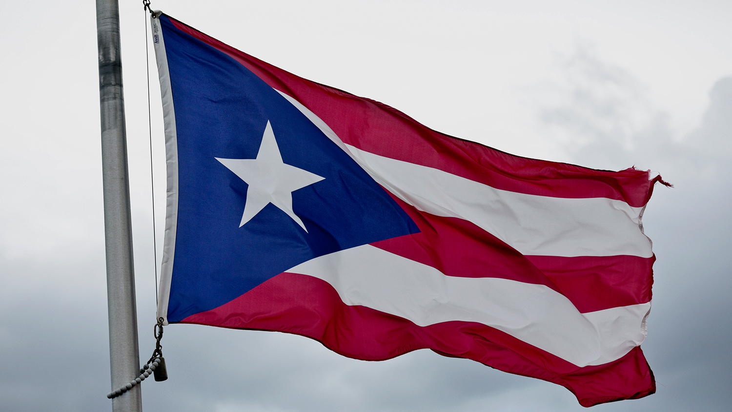 A Puerto Rican Flag flies in Old San Juan, Puerto Rico, on Tuesday, Aug. 18, 2015.

