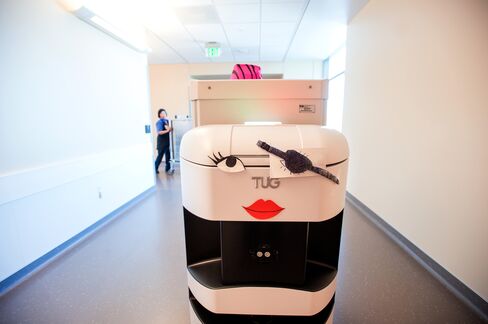 A TUG robotic courier carries supplies through the UCSF Medical Center.