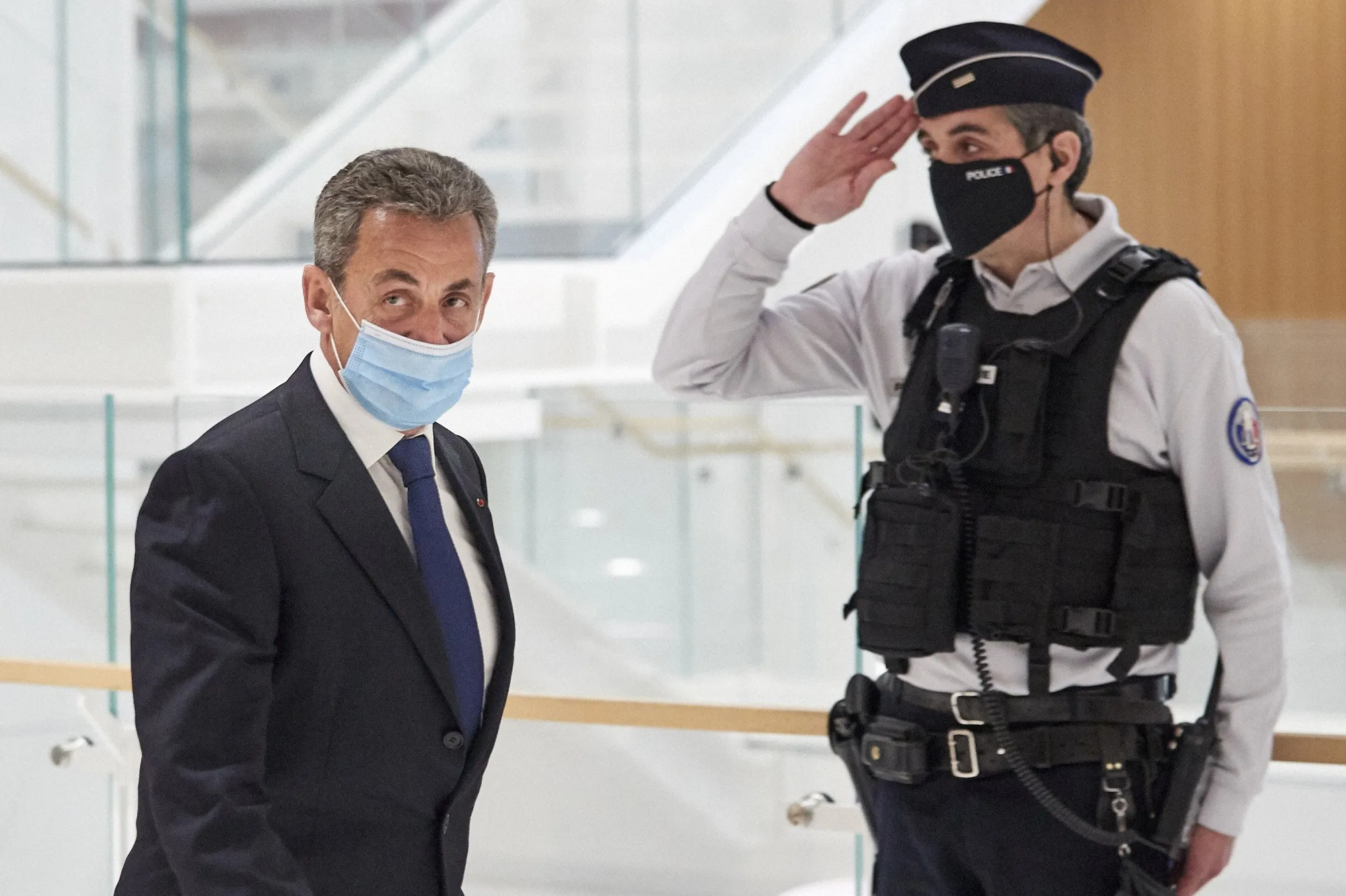 Nicolas Sarkozy leaves court after being found guilty of corruption on March 1.
