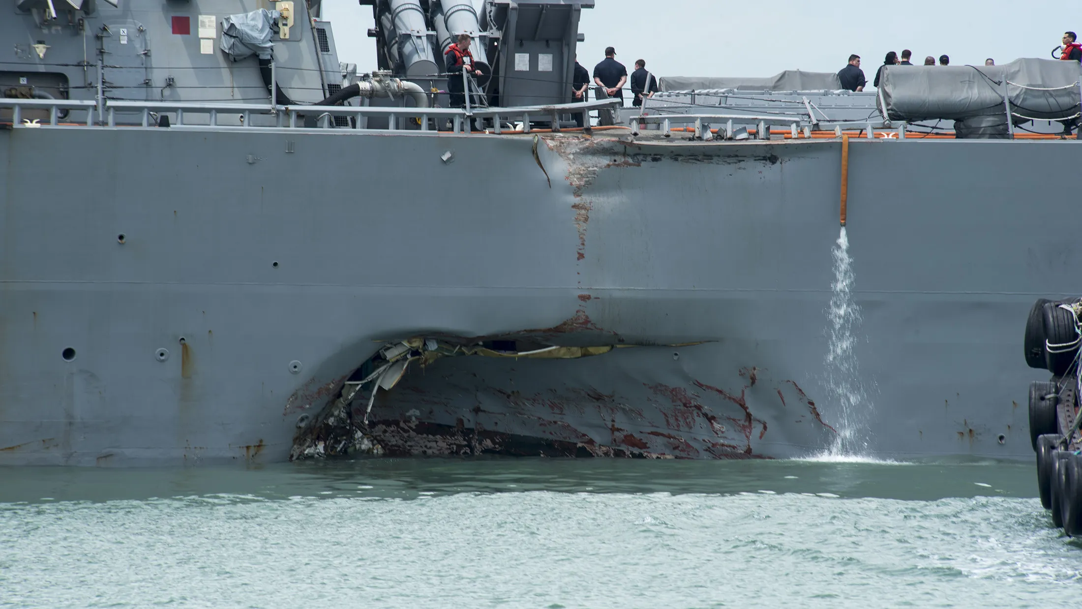 Damage to the portside of the USS John S. McCain destroyer following a collision with a merchant vessel while underway east of the Straits of Malacca and Singapore on Aug. 21, 2017.
