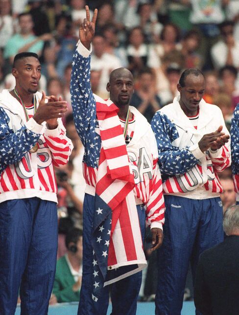 USA's Scottie Pippen, left, with Michael Jordan, center, and Clyde Drexler, with their gold medals, on Aug. 8, 1992.