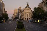 A car drives down the Gran Via in Madrid, Oct. 8.