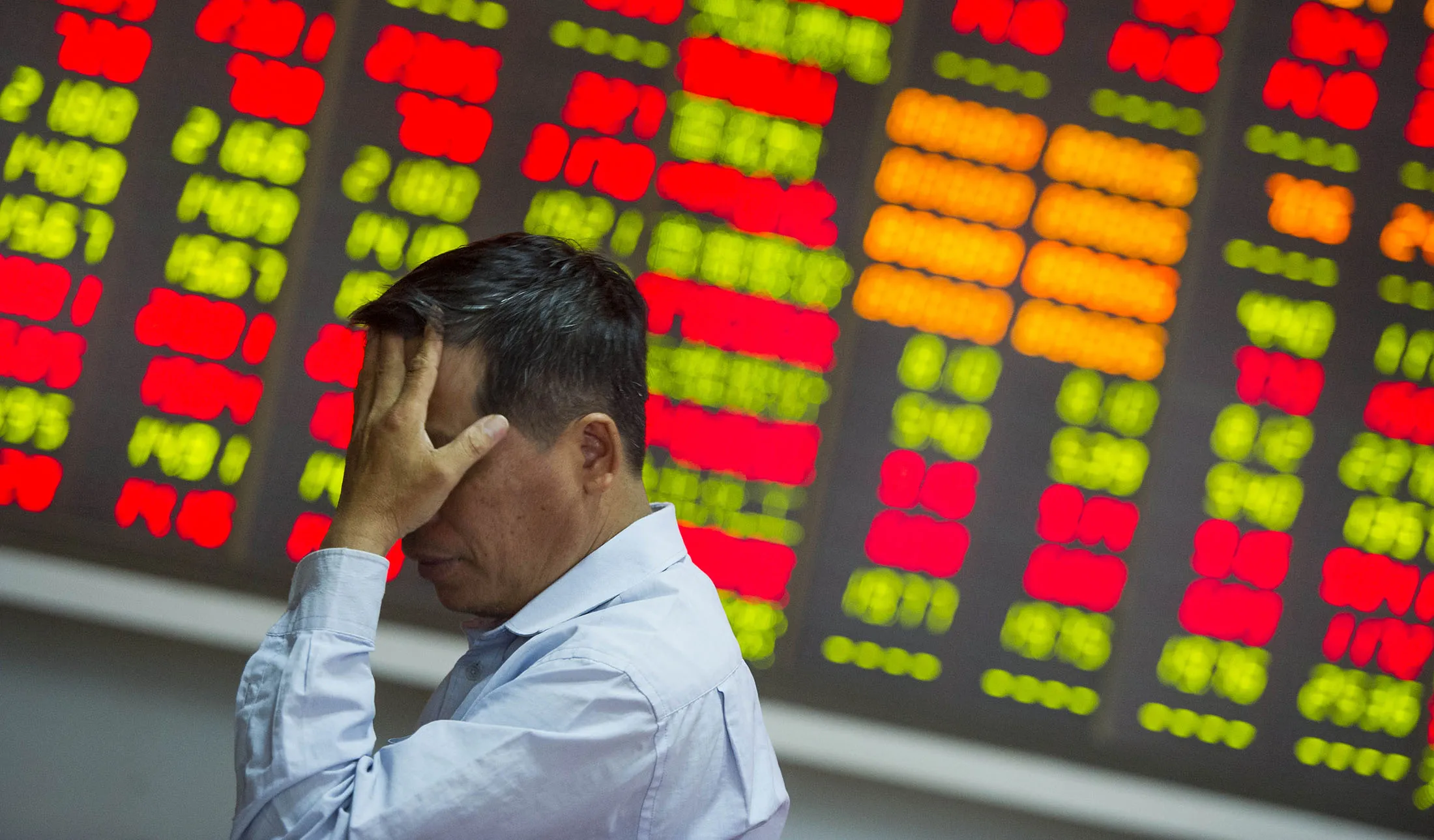 An investor reacts at a stock exchange hall in Haikou, China.
