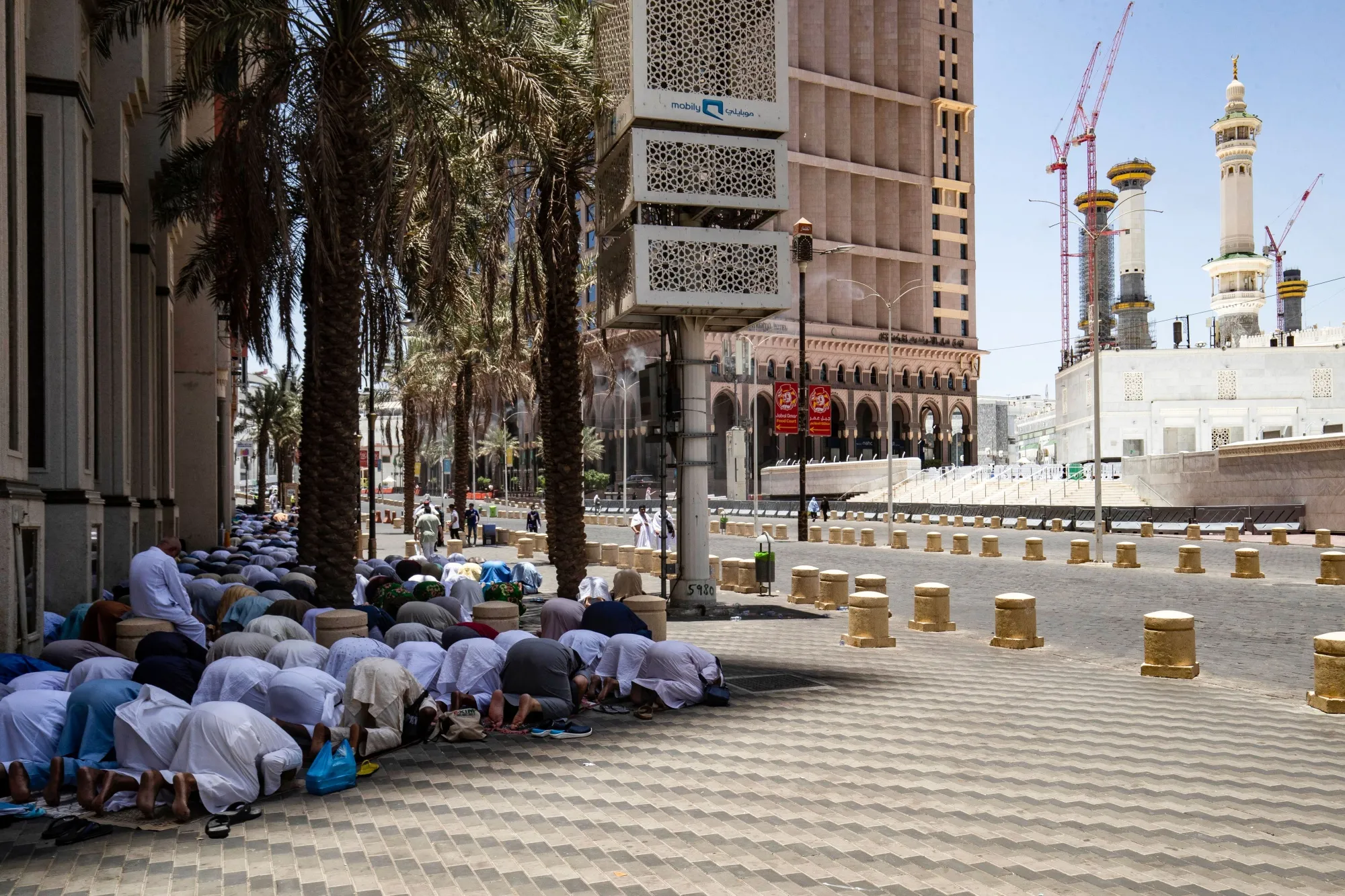 Men pray in the shade in Mecca, Saudi Arabia.