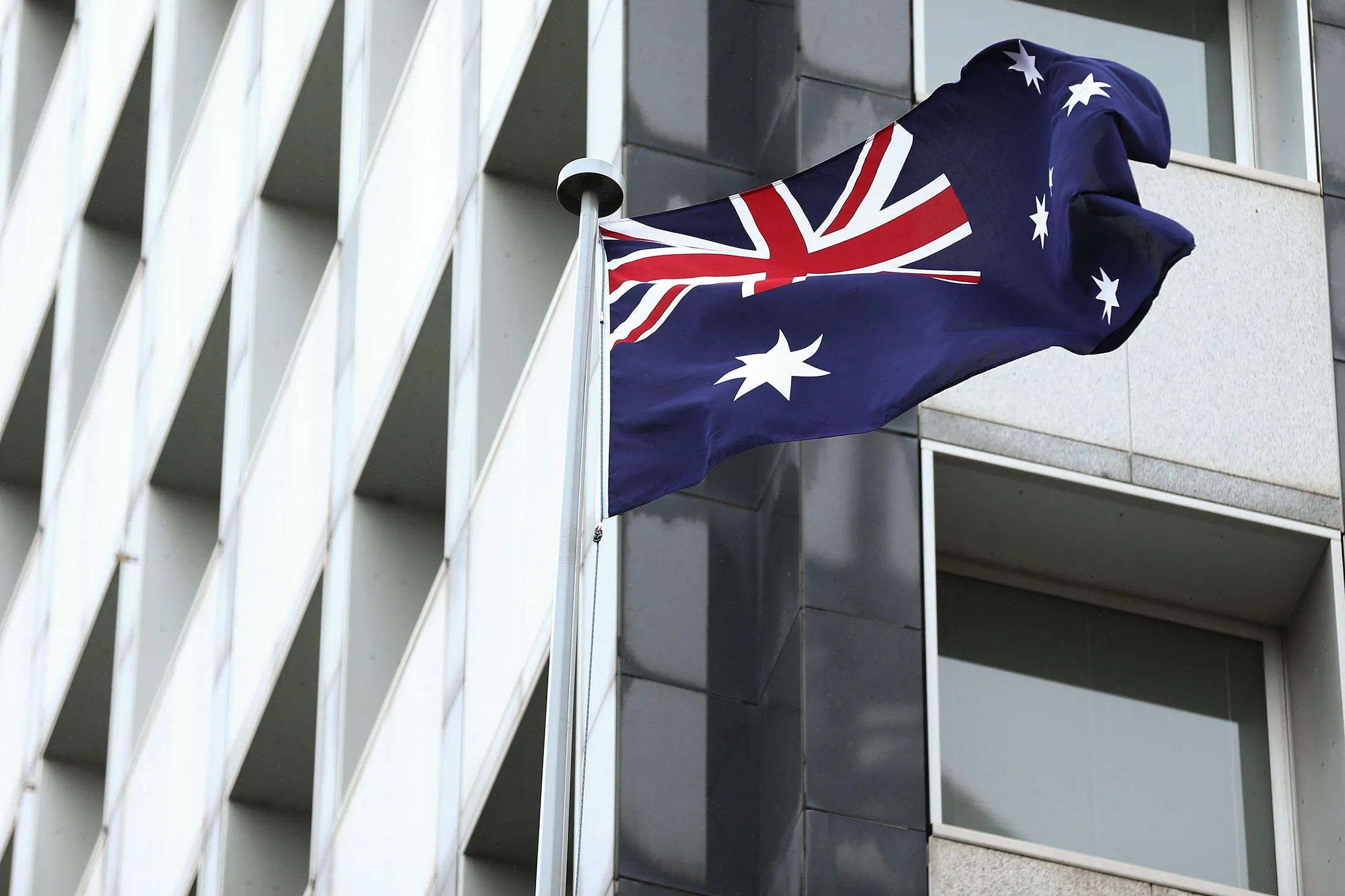 The Australian flag flies outside the Reserve Bank of Australia (RBA) headquarters in Sydney.