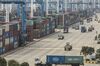 Containers sit stacked next to gantry cranes as trucks operate at the Port of Ningbo-Zhoushan in Ningbo, China, on Wednesday, Oct. 31, 2018. President Donald Trump wants to reach an agreement on trade with Chinese President Xi Jinping at the Group of 20 nations summit in Argentina later this month and has asked key U.S. officials to begin drafting potential terms, according to four people familiar with the matter.