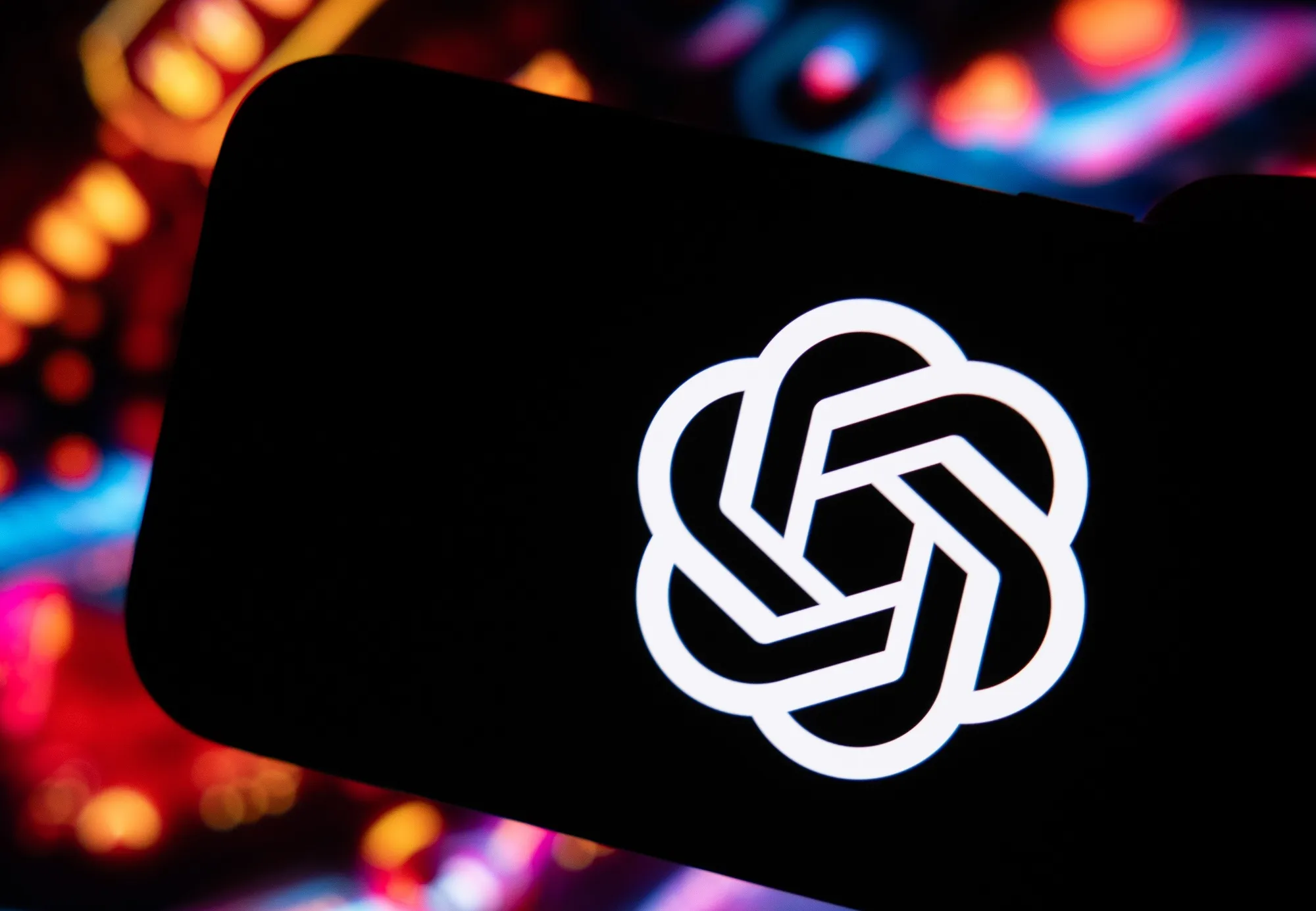 The ChatGPT virtual assistant logo on a smartphone.