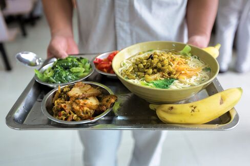 A Nourish meal of noodle soup with chicken, tomato and basil omelette, garlic vegetable sauté, and braised pork with pickled vegetables.