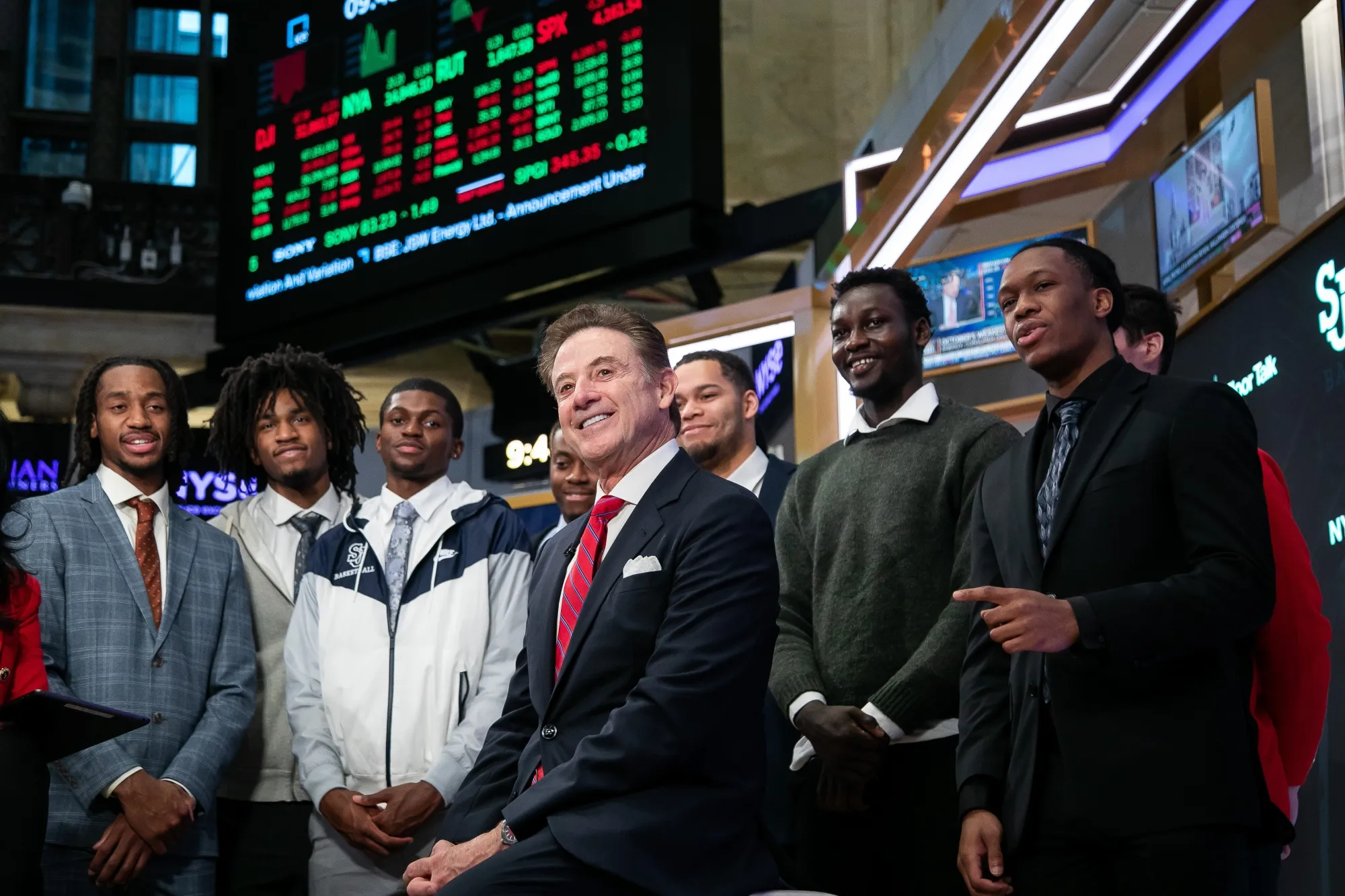 Rick Pitino, head coach of the St. John's men’s basketball team, center, at the New York Stock Exchange on Tuesday.