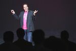 John Legere, CEO and President of T-Mobile USA, makes an announcement during an event about new contract pricing on March 26 in New York City