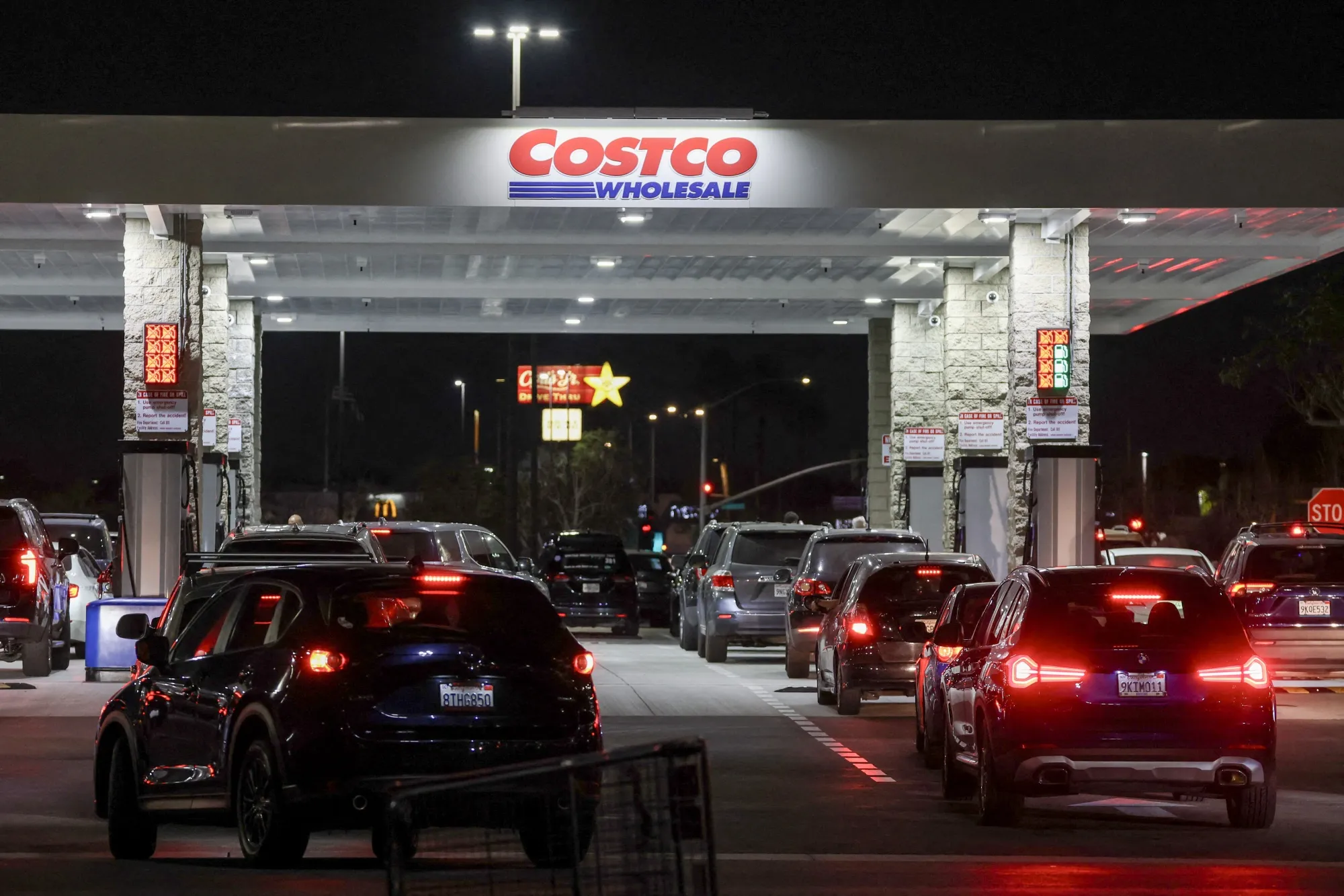 Drivers wait in their vehicles to pump gasoline at a Costco gas station in Hawthorne, California, on March 18.