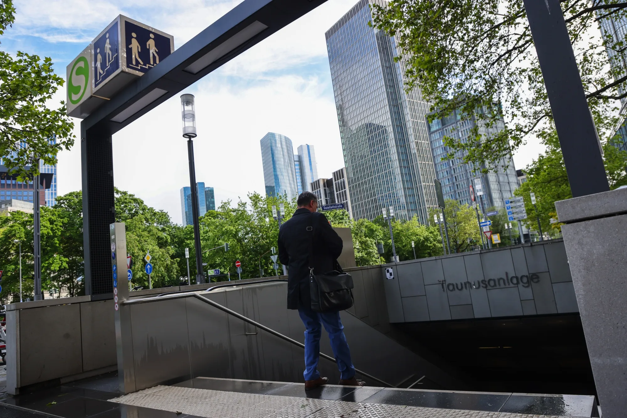 A city worker enters Taunusanlage U-Bahn underground train station in the financial district in Frankfurt. Germany.