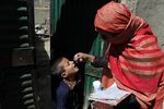 A health worker administers the polio vaccine to a child in Kabul, Afghanistan