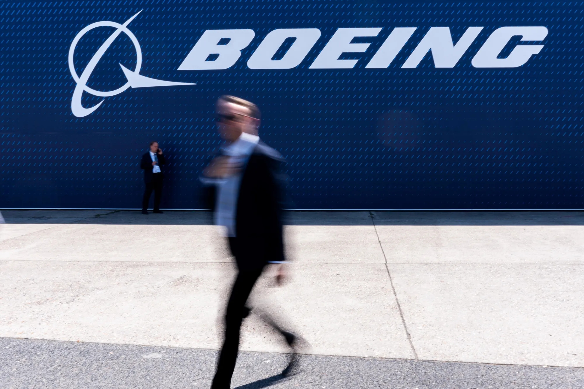 Visitors outside the Boeing pavilion at the Paris Air Show in Paris, France, on Wednesday, June 18, 2025. The 55th Paris Air Show runs 16-20 June at Le Bourget airport.