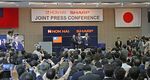 Terry Guo and Tai Jeng-wu (pose with Kozo Takahashi during a press conference in Osaka, Japan, on April 2. Sharp agreed to be bought by Taiwanese multinational Hon Hai Precision, the world's biggest electronics supplier. / AFP / JIJI PRESS / STR / Japan OUT (Photo credit should read STR/AFP/Getty Images)