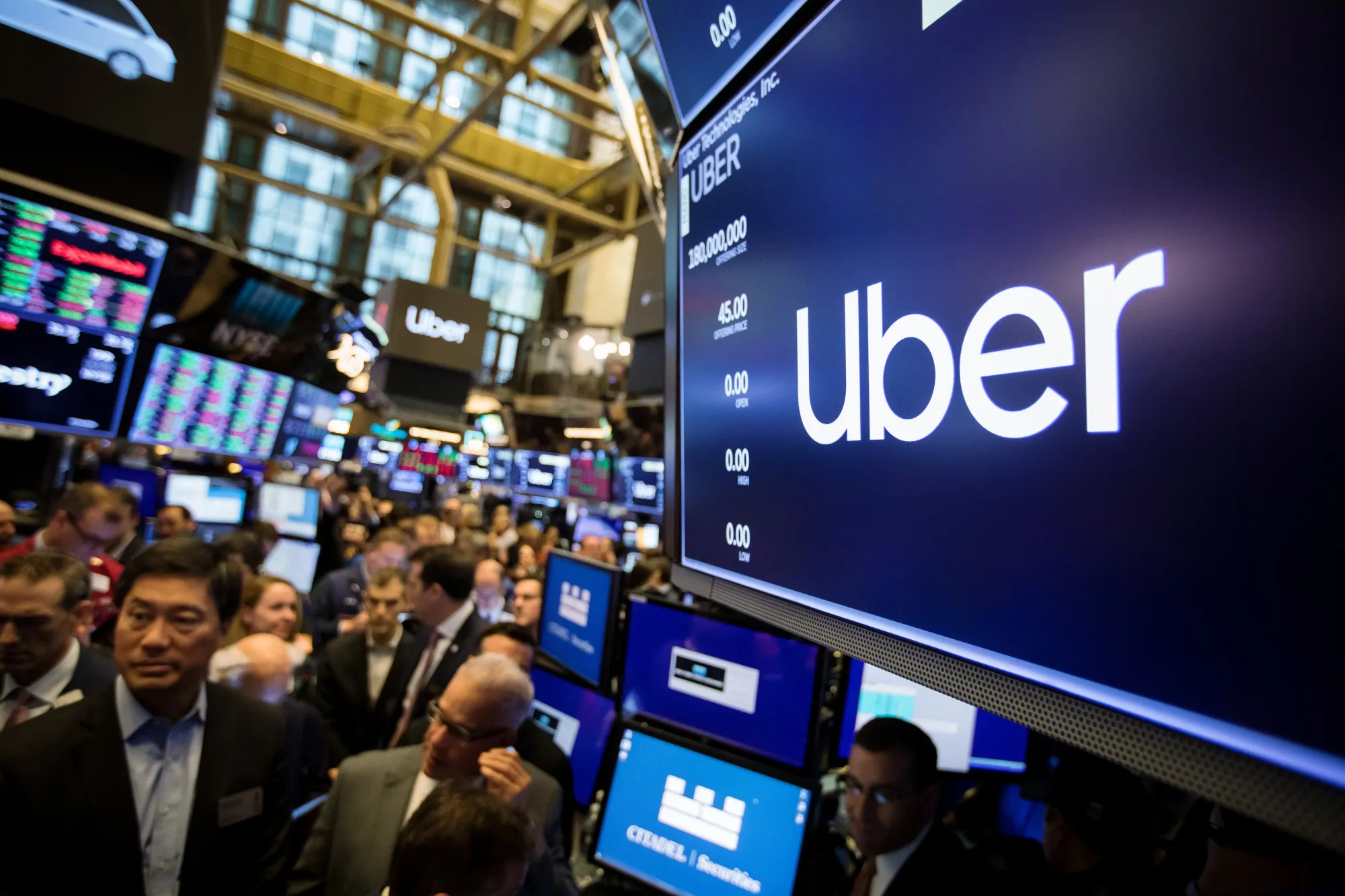 A monitor displays Uber Technologies Inc. signage during the company's initial public offering (IPO) on the floor of the New York Stock Exchange (NYSE) in New York, U.S., on Friday, May 10, 2019. The No. 1 ride-hailing company's shares will start trading on the New York Stock Exchange after it raised $8.1 billion in the biggest U.S. IPO since 2014, pricing shares at $45 each.