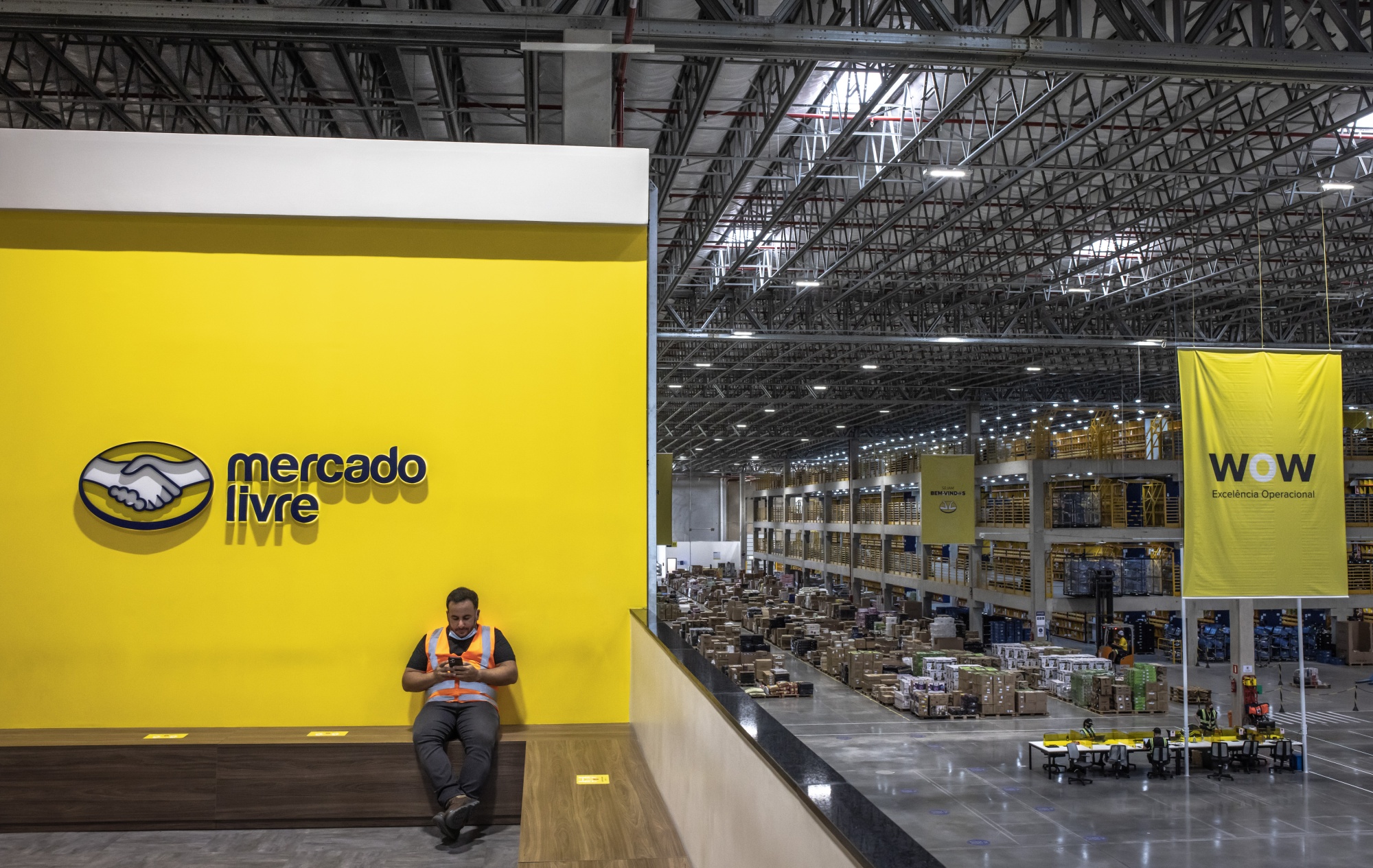 A worker takes a break at the MercadoLibre fulfillment center in Sao Paulo, Brazil.