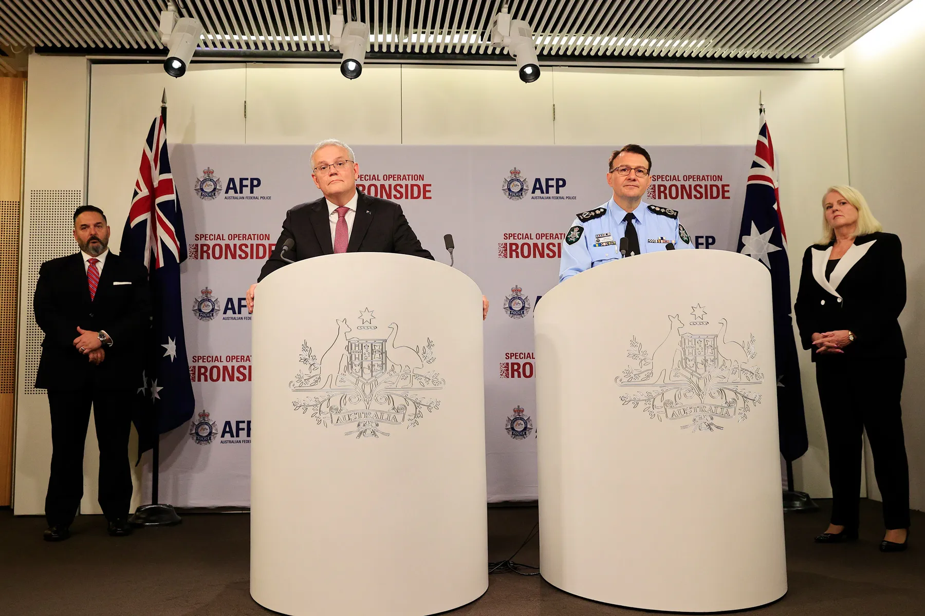 Scott Morrison, second left,&nbsp;and Reece Kershaw speak during a news conference in Sydney on June 8.
