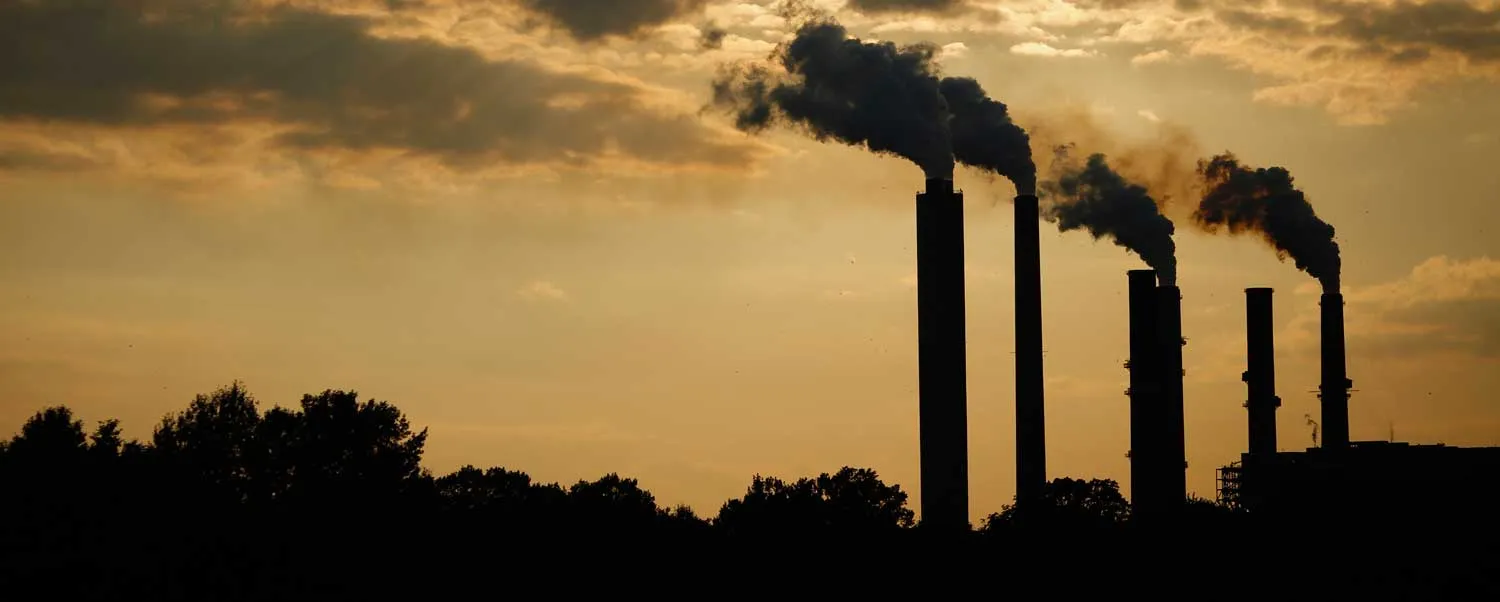 The silhouettes of emissions are seen rising from stacks of the Duke Energy Corp. Gibson Station power plant at dusk in Owensville, Indiana, U.S., on Thursday, July 23, 2015. Coal reclaimed its ranking as the top fuel for generating electricity at U.S. power plants in May, beating natural gas, which took the number one spot for the first time in April. Photographer: Luke Sharrett/Bloomberg via Getty Images
