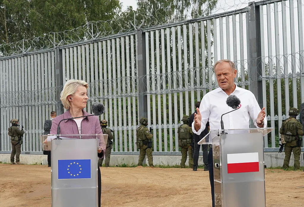 Donald Tusk and Ursula von der Leyen speak at the Poland/Belarus border, on Aug. 31.