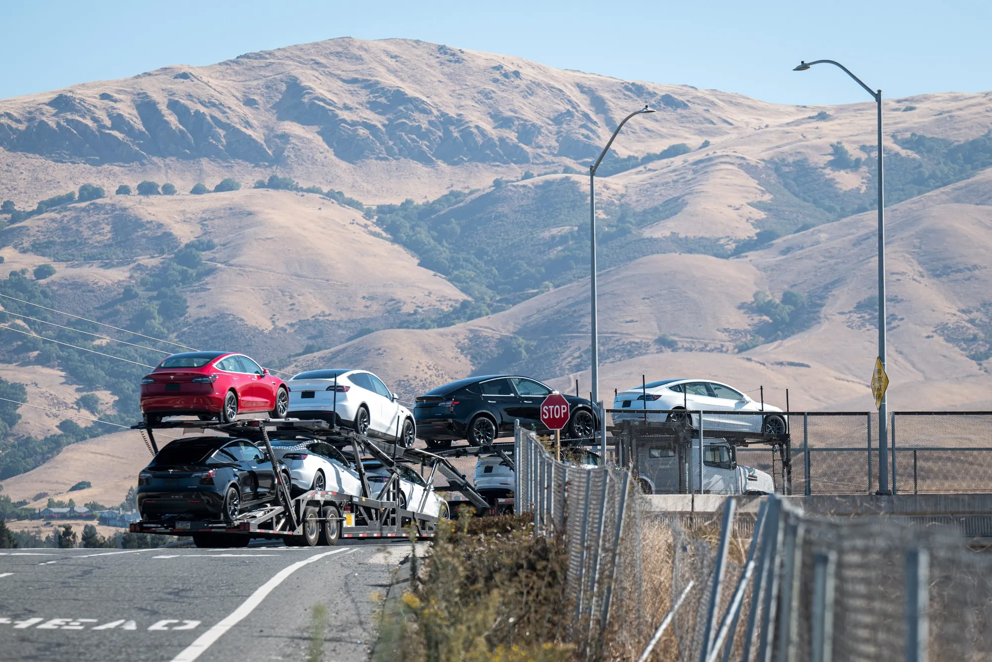 A load of&nbsp;Tesla cars outside the company's assembly plant in Fremont, California.