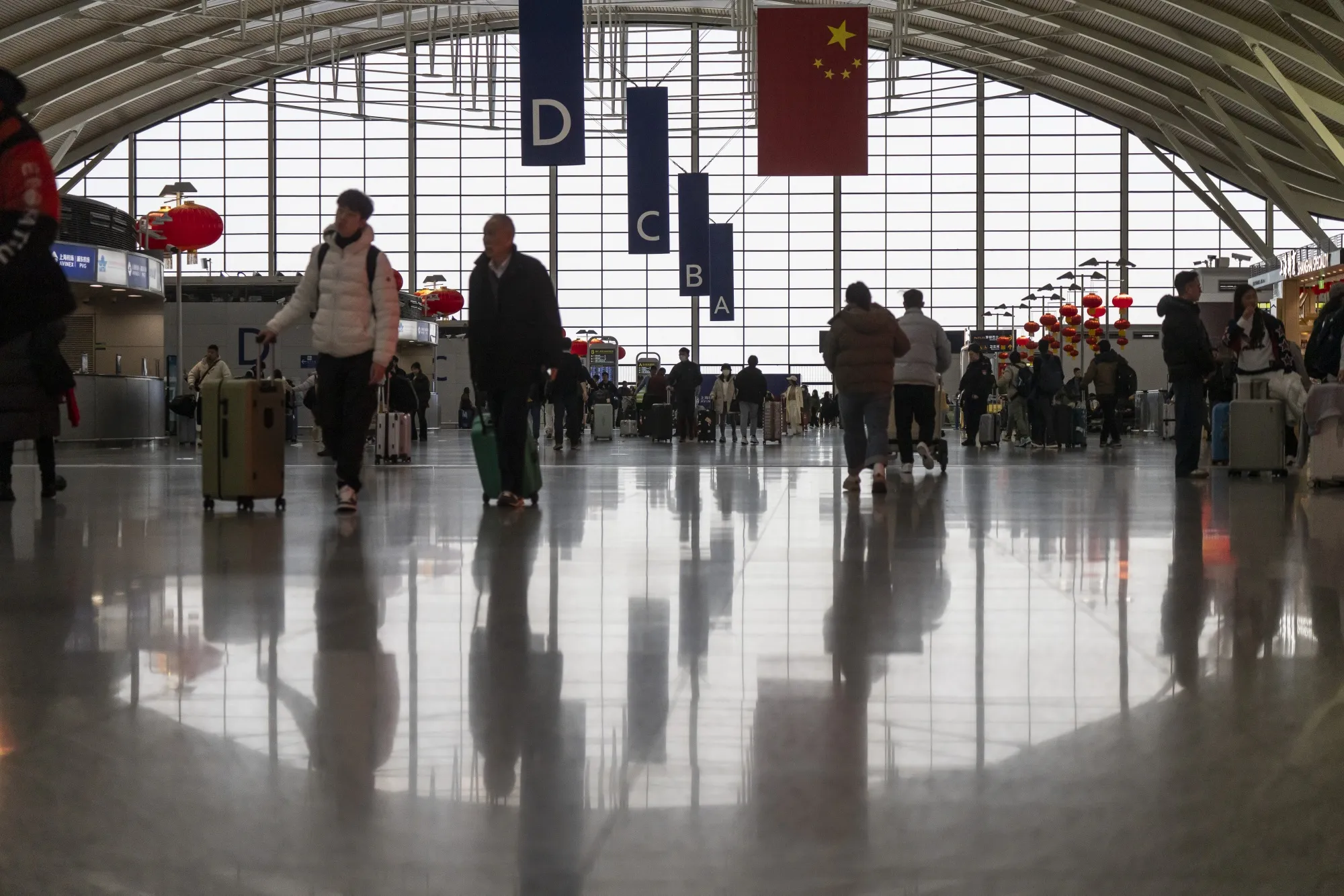 Travelers at the Pudong International Airport&nbsp;in Shanghai.