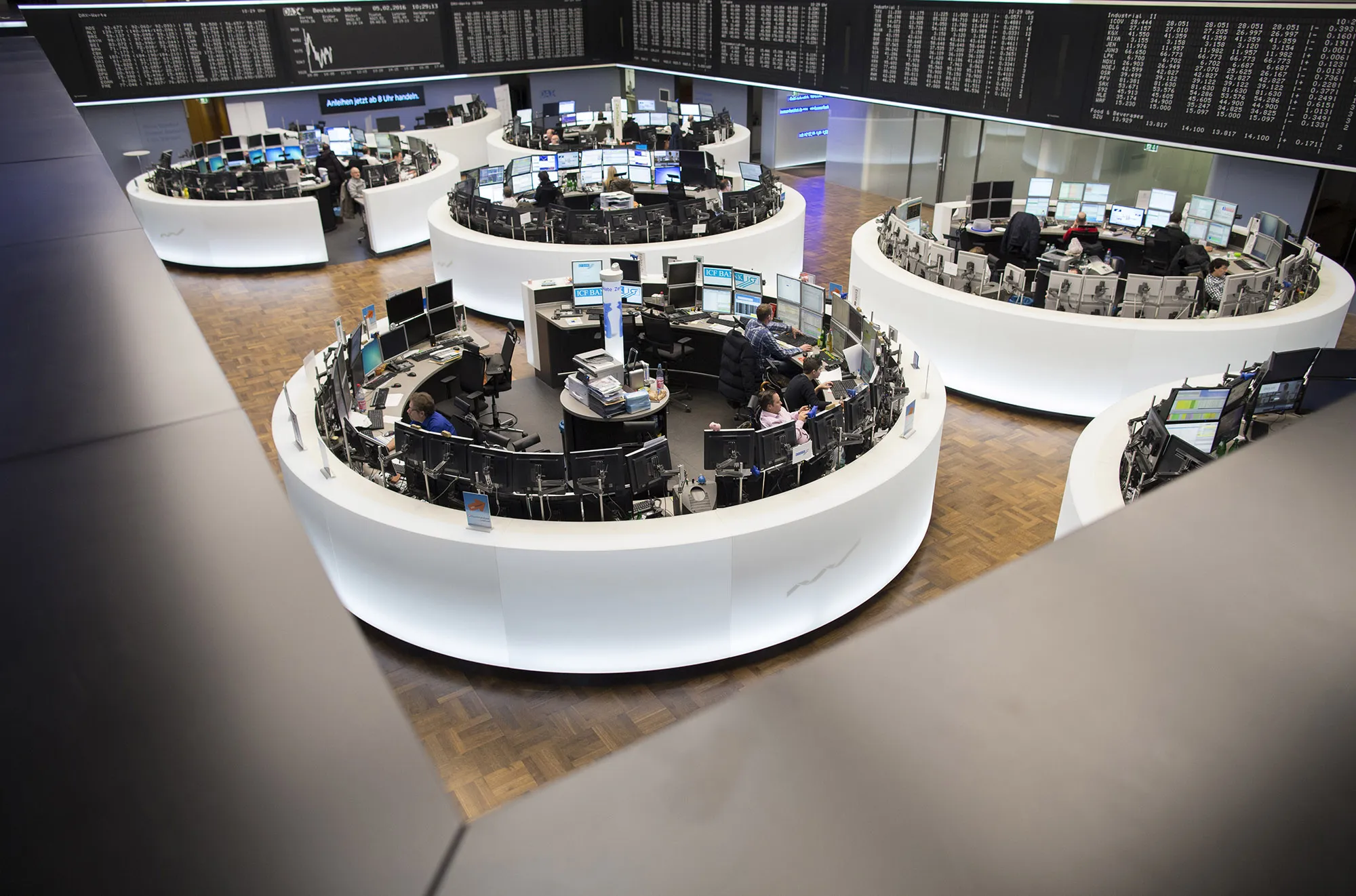 Financial traders monitor data inside Frankfurt Stock Exchange in Frankfurt.