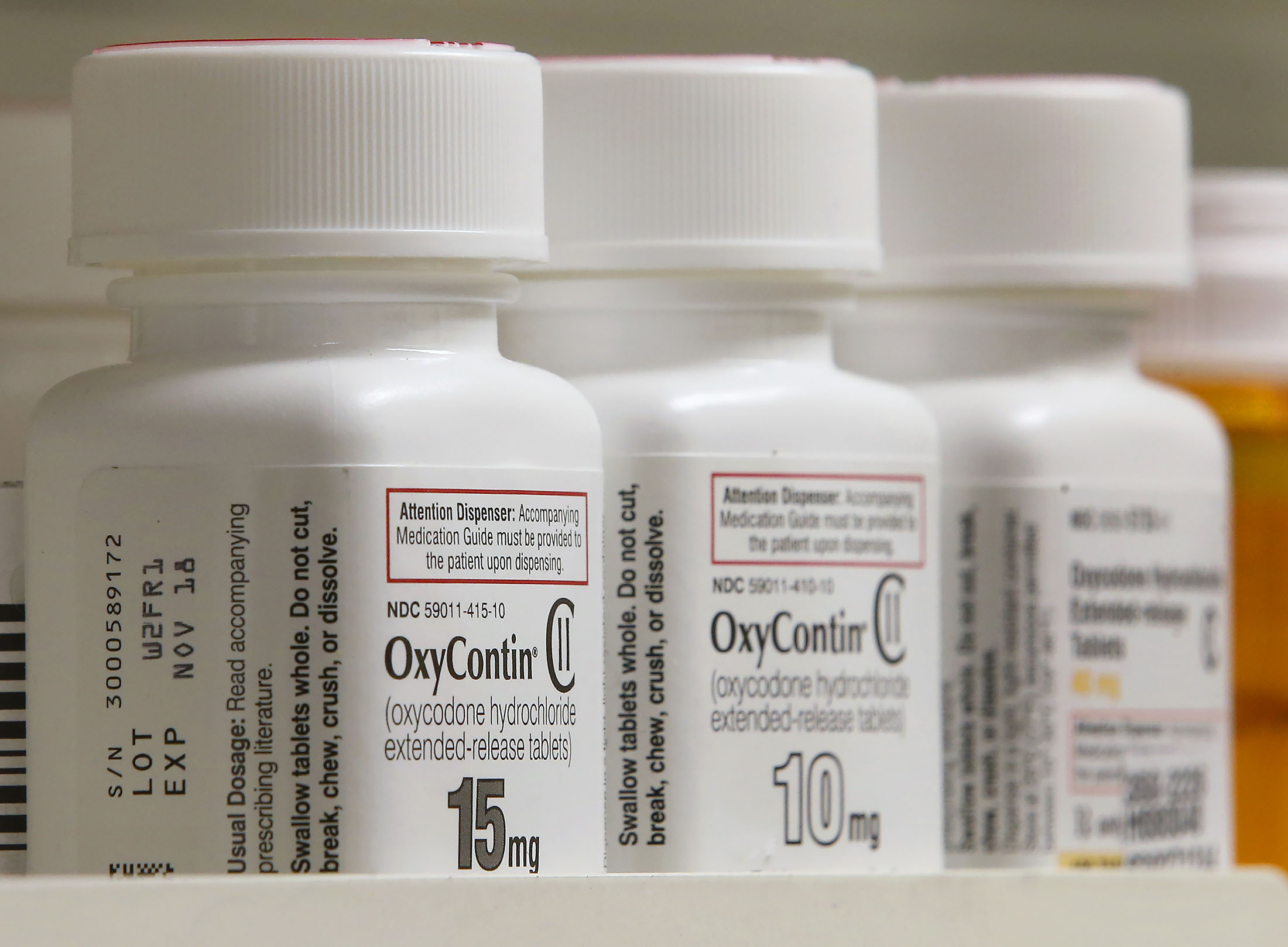 Bottles of Purdue Pharma L.P. OxyContin medication sit on a pharmacy shelf in Provo, Utah, on Aug. 31, 2016.
