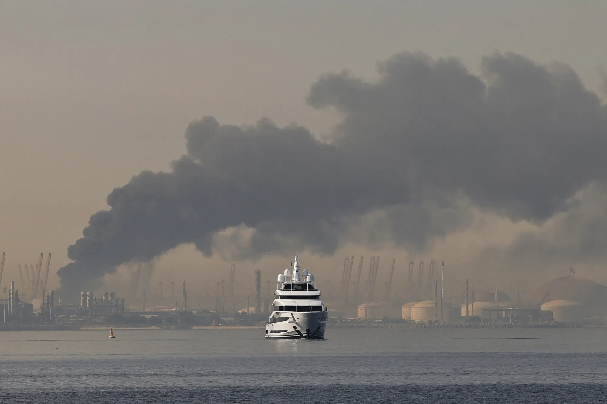 A plume of smoke rising from the port of Jebel Ali following a reported Iranian strike in Dubai.