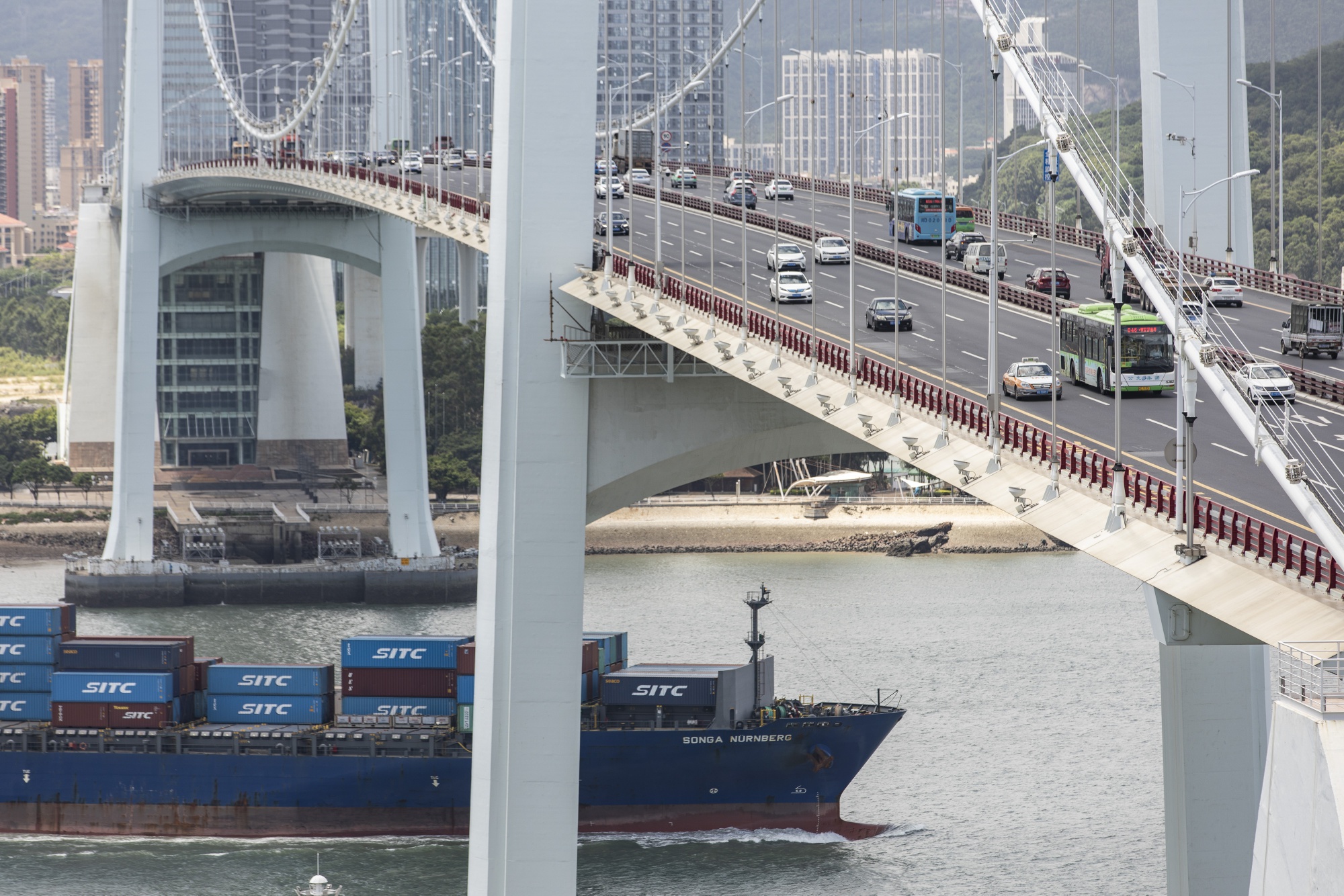 A container ship approaches the Haicang Bridge in Xiamen, China.&nbsp;