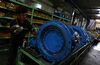 An employee assembles a valve on the production line at the Samjin Precision Co. factory inside the Daejeon Industrial Complex in Daejeon, South Korea, on Friday, Nov. 8, 2013. Manufacturers’ business confidence rises to 79 in Jan. from 78 in Dec., according to a Bank of Korea statement. A reading below 100 indicates that pessimists outnumber optimists.