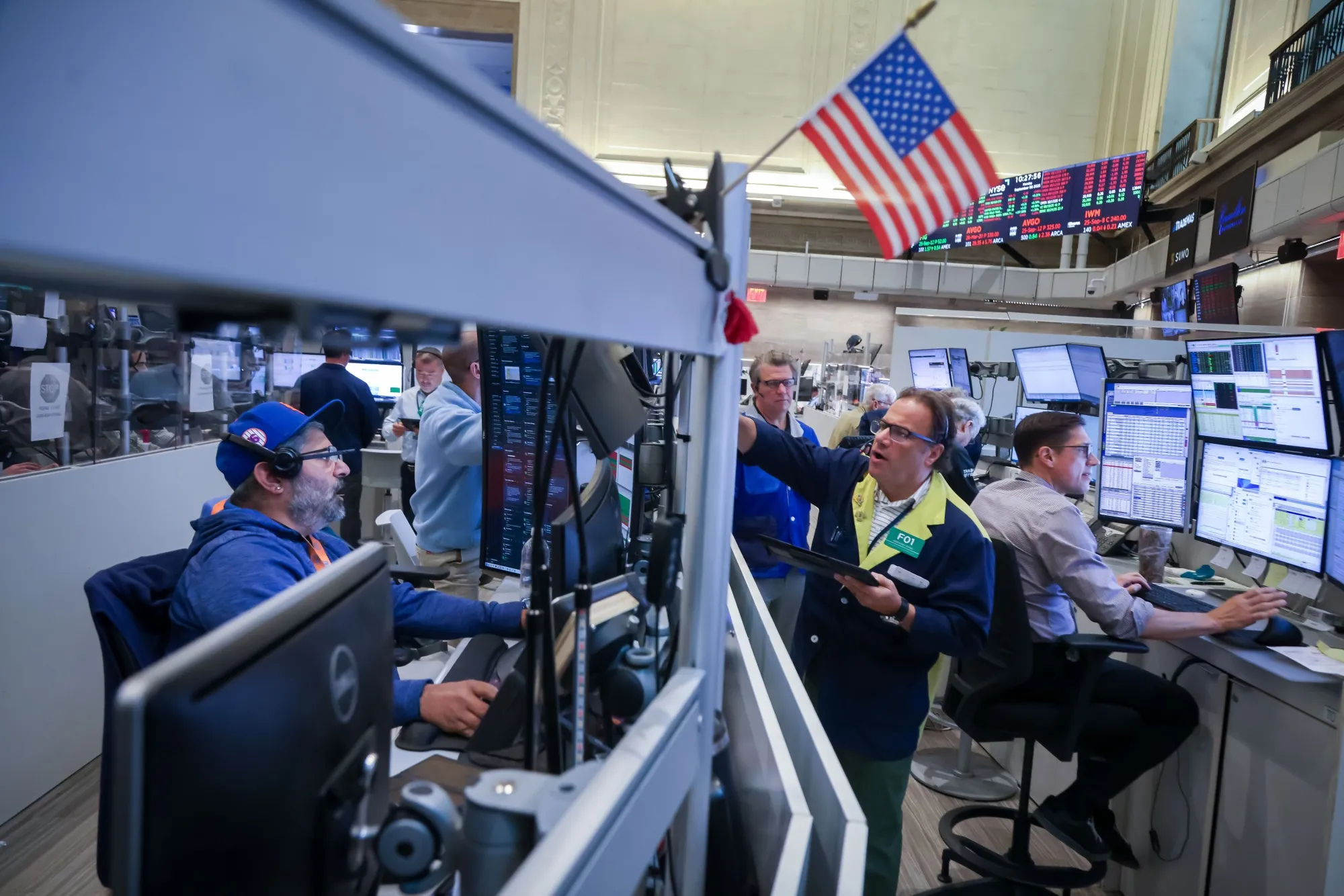 Traders work on the floor of the American Stock Exchange.