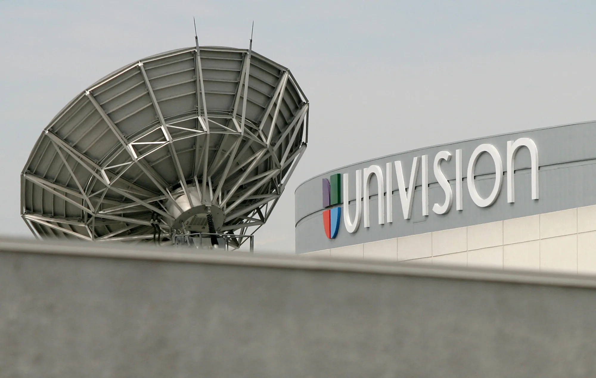 A satellite dish is positioned on the roof of Univision Communications Inc. in Los Angeles.