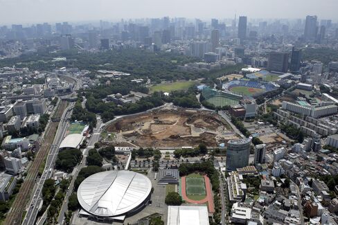 A construction site for a new stadium to replace the National Olympic Stadium, center, is seen in this aerial photograph taken in Tokyo. Photographer: Kiyoshi Ota/Bloomberg