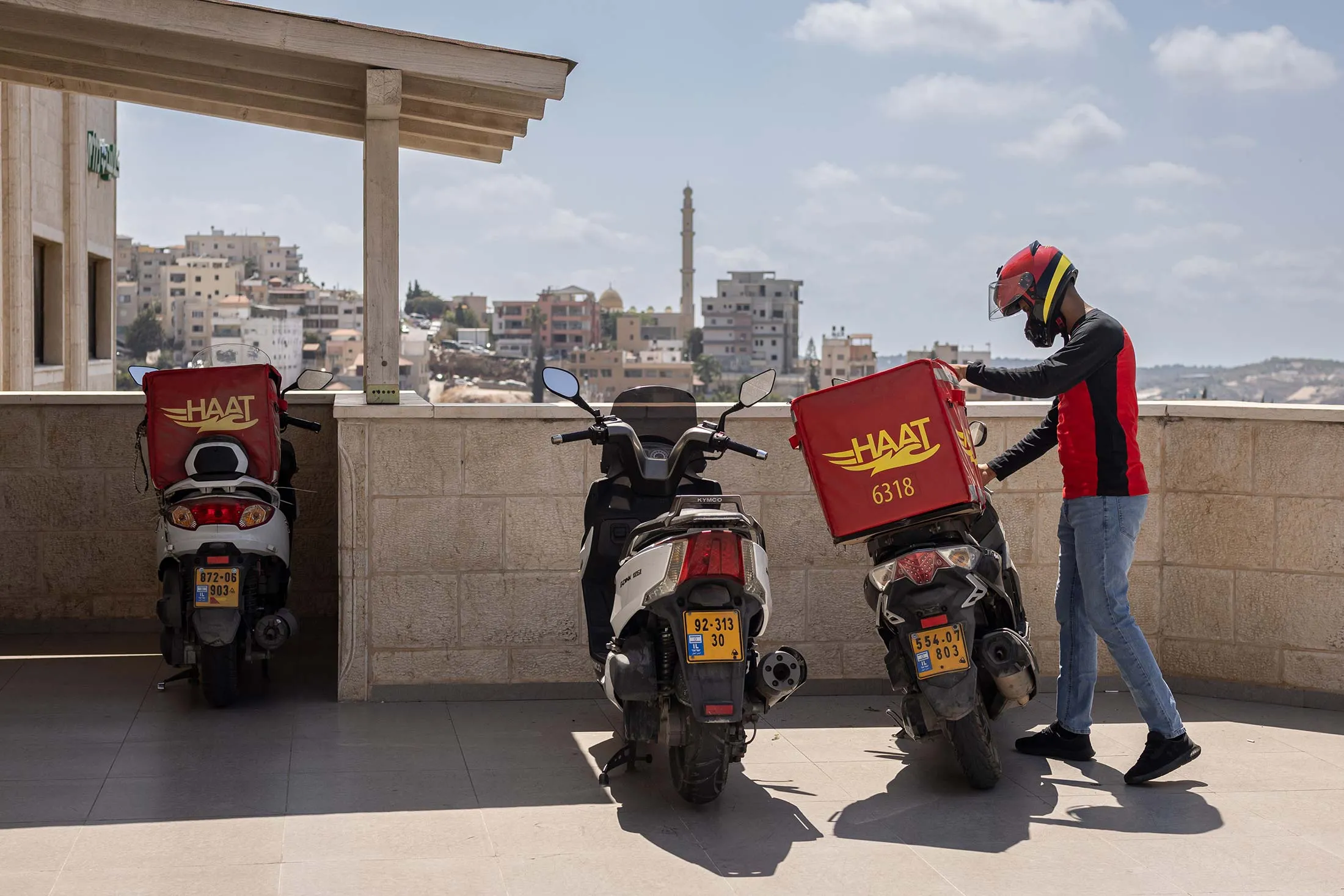 A Haat courier during a delivery in Umm al-Fahm, Israel.