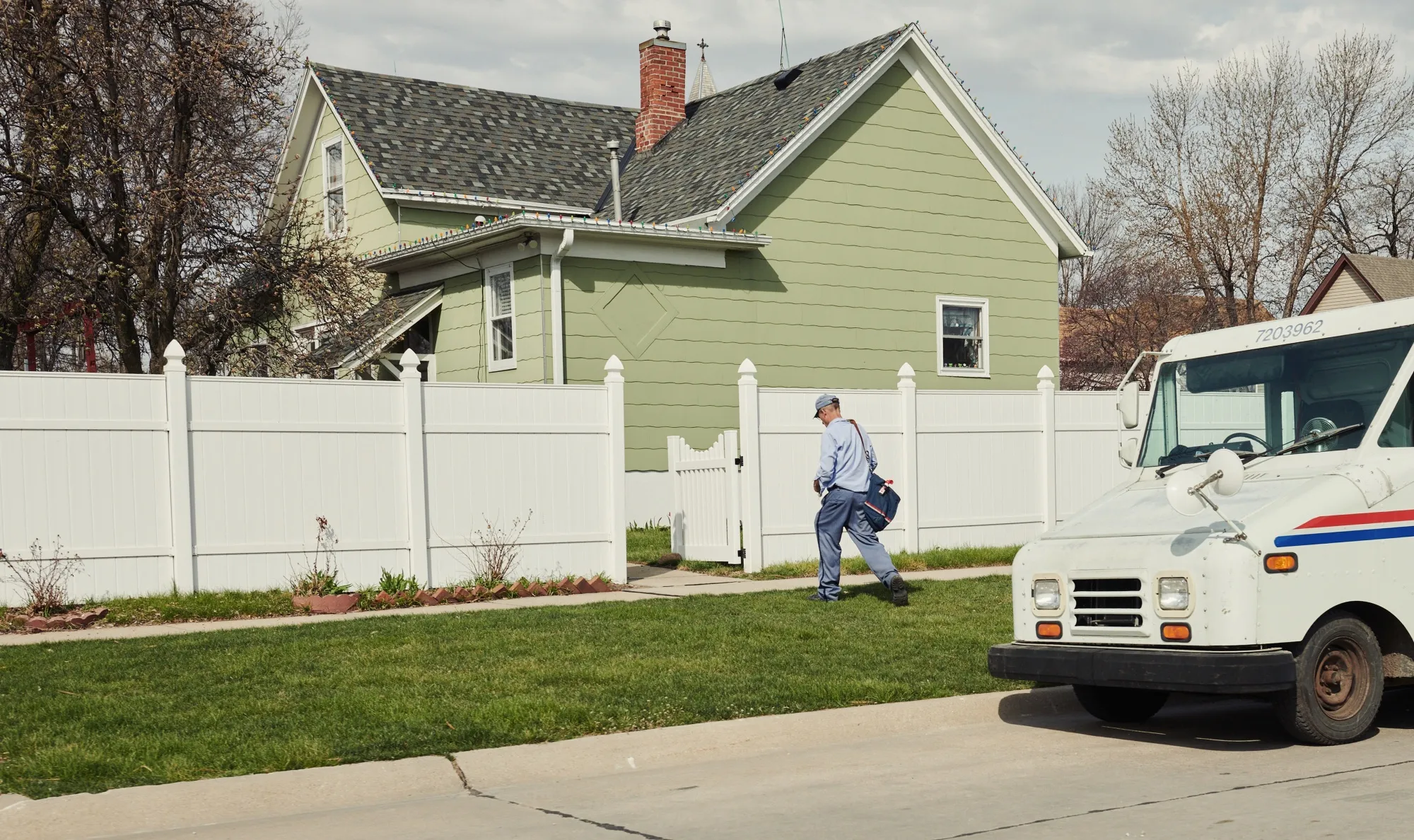 A United States Postal Service (USPS) worker delivers mail in Grand Island, Nebraska, U.S., on April 22.