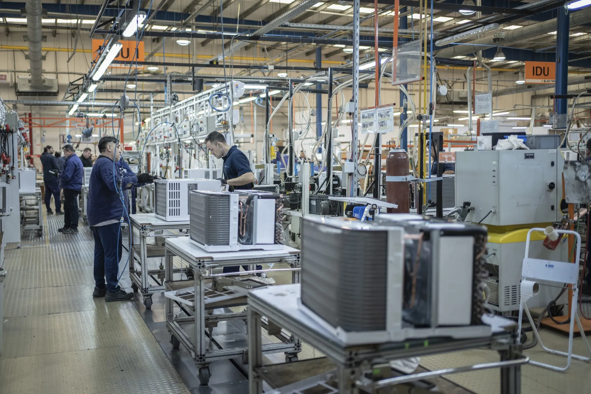 Workers assemble air conditioners at a factory in Rio Grande, Tierra del Fuego, Argentina.