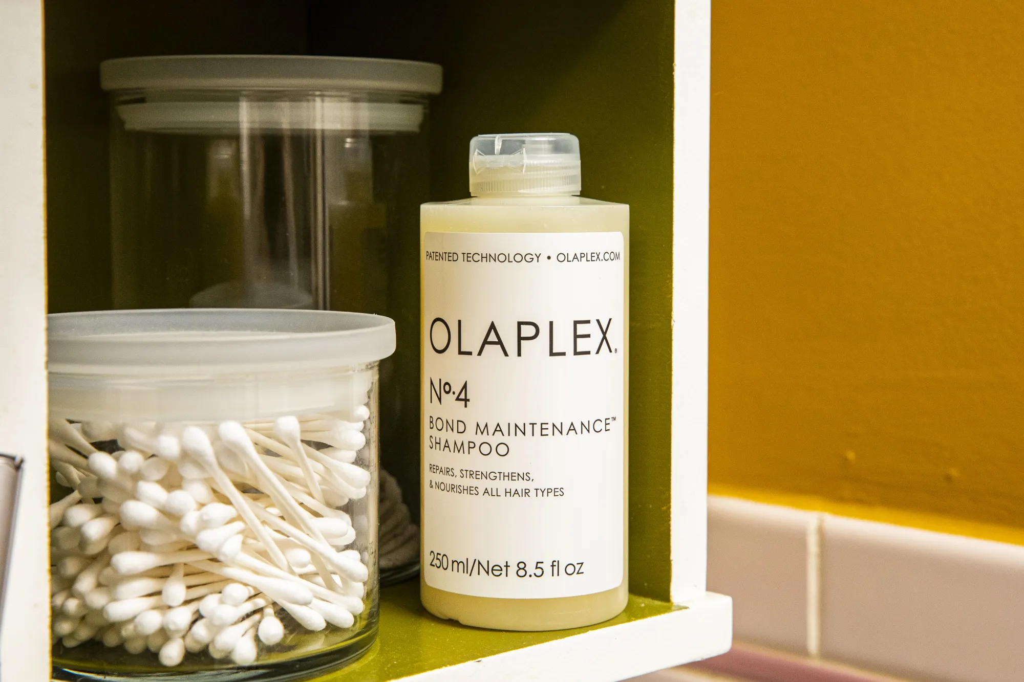 A bottle of Olaplex shampoo.
