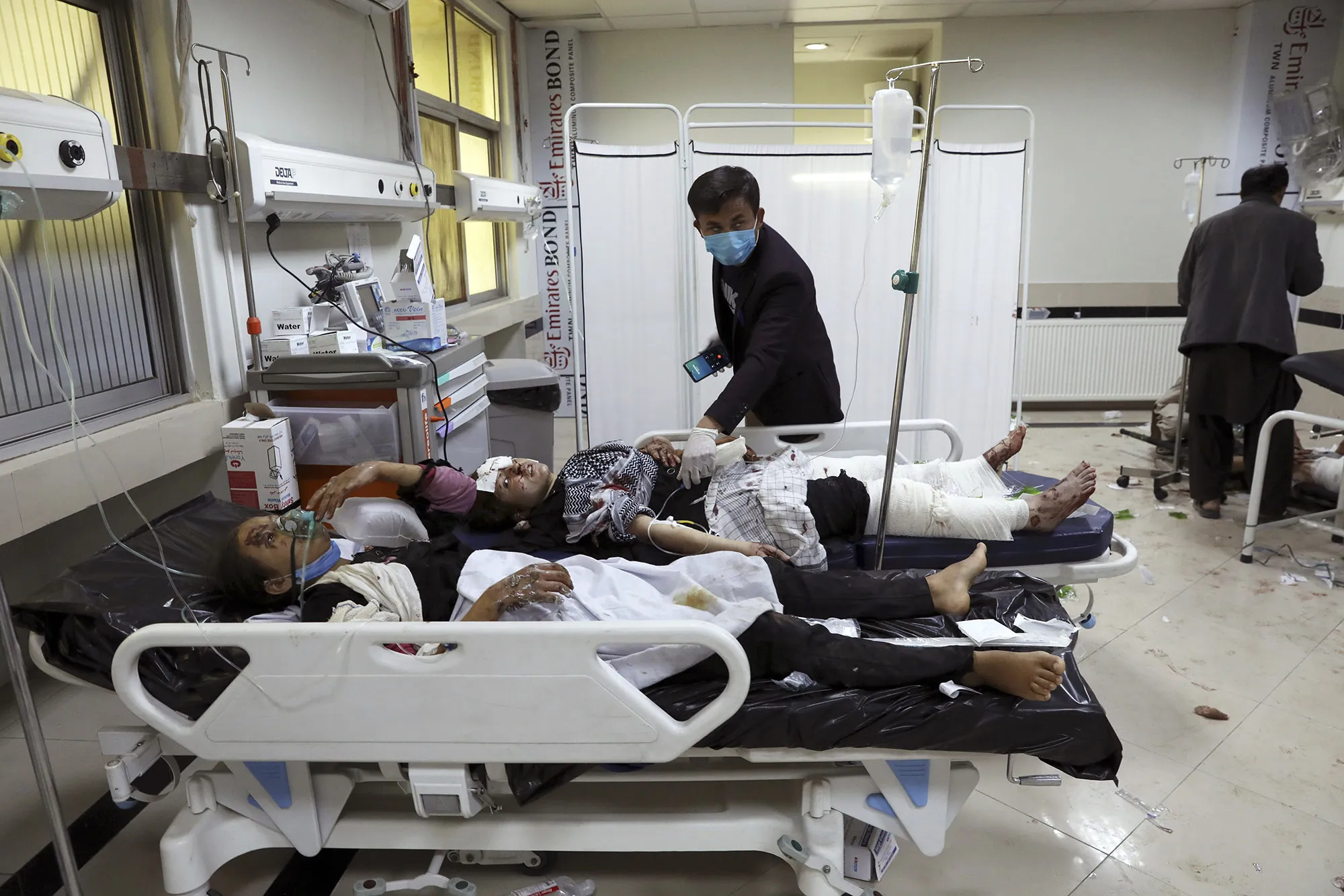 Afghan students are treated at a hospital after a bomb explosion near a school in west of Kabul, Afghanistan, May 8.